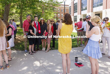 Braden Fink and family pose for photos following the UNL undergraduate commencement in Memorial Stad