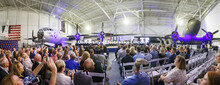 World War II era B-29, left, and C-47 were the backdrop for the ceremony. The university’s Air For