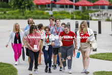 A group of NSE students led by Kate Vermilyea walk across campus. New Student Enrollment, June 1, 20