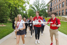 A group of NSE students led by Jack Kinney walk across campus. New Student Enrollment. June 1, 2022.