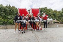 Jack Kinney’s NSE group leaps in front of the inflatable N sculpture on the Union Plaza after tour