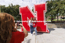 Grace and Emma Alder, twin sisters from Atkinson, NE, pose for NSE Leader Hannah-Kate Kinney in fron