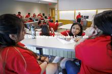 Ana Cortez Martir, junior from Omaha South High school, works with her team as they develop a busine