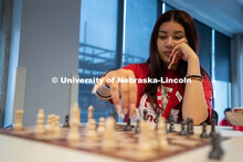 An attendee makes a move during a game of chess at the Nebraska College Preparatory Academy’s Scie