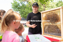 Discovery Day attendees learn about bees. The East Campus Discovery Days and Farmer’s Market at UN