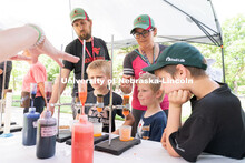 Discovery Day attendees look at different mixtures. The East Campus Discovery Days and Farmer’s Ma