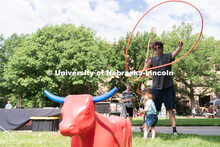 A Discovery Day attendee attempts to lasso a practice cattle model. The East Campus Discovery Days a