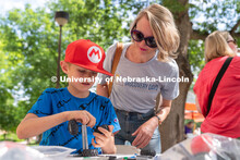 Discovery Day attendees work together to build a lego car. The East Campus Discovery Days and Farmer