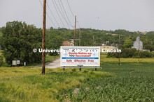 Billboard aimed at members of the Omaha Nation, promoting vaccination. Possible use with rural or tr