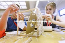 High school students in the College of Architecture high school camp work on their projects with Azi