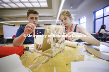 High school students in the College of Architecture high school camp work on their projects with Azi