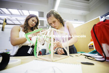 High school students in the College of Architecture high school camp work on their projects with Azi