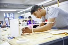 High school students in the College of Architecture high school camp work on their projects with Azi