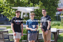 Journalism professor Matt Waite, watches as Lincon (sp) Kuhn of North Platte launches a drone. Miles