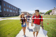 Erin Sheehy of Hastings talks with New Student Orientation Leader Trenton Hammond as his group tours