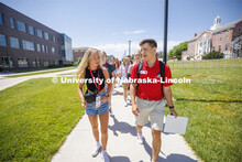 Erin Sheehy of Hastings talks with New Student Orientation Leader Trenton Hammond as his group tours