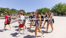 New Student Orientation Leader walking on campus with their student groups. June 16, 2022. 