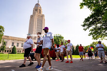 University of Nebraska representatives walk around the Capitol during the Star City Pride parade. Ju