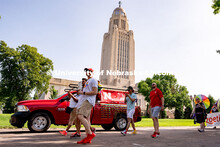 University of Nebraska representatives walk around the Capitol during the Star City Pride parade. Ju