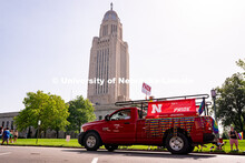 University of Nebraska representatives circle around the Capitol during the Star City Pride parade. 