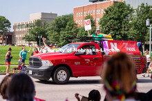 University of Nebraska representatives wave to the crowd during the Star City Pride parade. June 18,