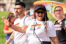 University of Nebraska representatives wave to the crowd during the Star City Pride parade. June 18,