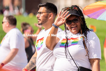 University of Nebraska representatives wave to the crowd during the Star City Pride parade. June 18,