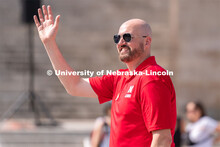 University of Nebraska representatives wave to the crowd during the Star City Pride parade. June 18,