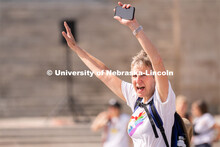 University of Nebraska representatives wave to the crowd during the Star City Pride parade. June 18,
