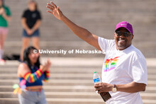 University of Nebraska representatives wave to the crowd during the Star City Pride parade. June 18,
