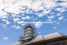 Scaffolding work begins to surround the Love Library cupola as part of the renovation process. Love 