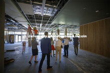 Chancellor Ronnie Green and donors take a tour of the renovated College of Law library. The $6 milli