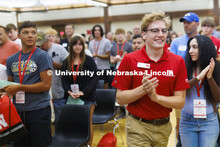 New Student Enrollment leader Paul Pechous runs into the Union ballroom to start the day. June 22, 2