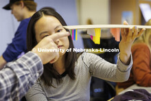 Lloyd “Bud” Shenefelt, Assistant Professor of Architecture, critiques a hanging design by first 