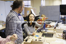 Lloyd “Bud” Shenefelt, Assistant Professor of Architecture, critiques a hanging design by first 