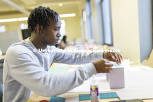 Jaylen Epting, a second-year student from Omaha, works on his design in Lloyd “Bud” Shenefelt’