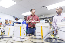 Derek Heeren and his class work with measuring water content in soil samples in his Irrigation Labor