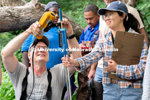Research Engineer Alan Boldt (left) and Jamie Duan (right) assemble tools to measure the water flow 
