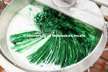 Food coloring and flavor swirl together in the mixing vat. Dairy Store 4-H Clover Mint is being made