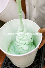 Dairy Store 4-H Clover Mint is extruded into 3-gallon buckets after it comes out of the machine whic