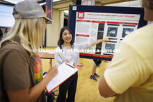 Nebraska architecture student Elena Garcia describes her summer research to the judges at the fair. 