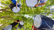 The Cornhusker Marching Band percussion groups kick off the school year. Bass drummers, clockwise fr
