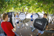 The Cornhusker Marching Band percussion groups kick off the school year. Bass drummers, from left, A