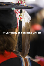 Chelsie West wears an eagle feather on her mortar board. West, a member of the Rosebud Lakota tribe,