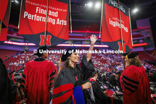 Farzaneh Mousavi waves to family and friends as the graduates enter the arena. Nebraska grants about