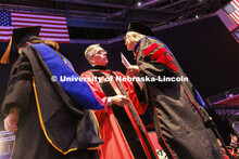 Chancellor Ronnie Green congratulates each doctoral and masters degree graduates during the ceremony