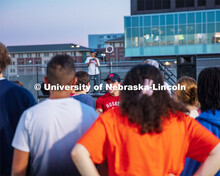 Students listen to the speaker during the Playfair activity at the Vine Street Fields Wednesday nigh