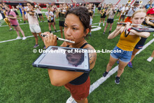 Vivika Ortiz uses an iPad balanced on her arm to keep track of her music and choreography along with