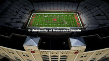 The band forms an outline of the state of Nebraska. Cornhusker Marching Band practice in Memorial St