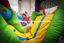 Students tumble through the inflatable obstacle course at Harper Schramm Smith residence halls block